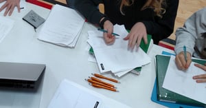 Person writing down idas on a sheet of paper